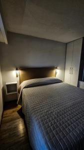 Łóżko lub łóżka w pokoju w obiekcie Alto 21 Suite