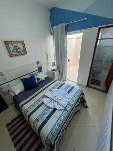 Cama ou camas em um quarto em Pousada Antares