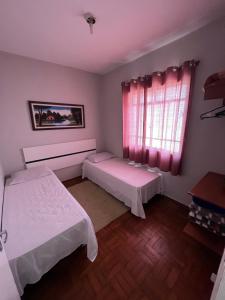Cama ou camas em um quarto em Pousada Antares