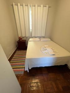 Cama ou camas em um quarto em Pousada Antares