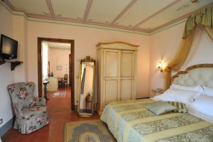 Postel nebo postele na pokoji v ubytování Relais Castelluccio Palusse