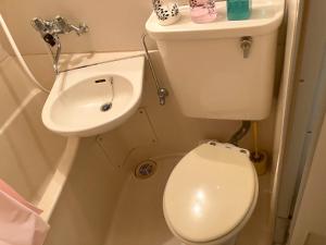 a small bathroom with a toilet and a sink at Nishimoto Building - Vacation STAY 16012v in Hiroshima
