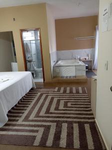 Cama ou camas em um quarto em Pousada Antares