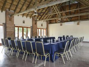 a large room with a long table and chairs at Montebelo Gorongosa Lodge & Safari in Chitengo +33 photos