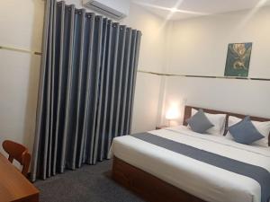 Ліжко або ліжка в номері Nimith Hotel & Restaurant