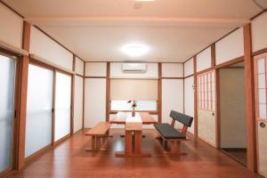 a room with a table and a chair in it at 飛騨高山　一の心 in Takayama