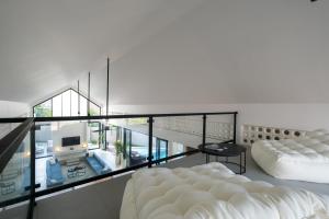 Postel nebo postele na pokoji v ubytování Bingin Breeze + 27 fotografií