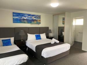 Postel nebo postele na pokoji v ubytování Frankston Motel