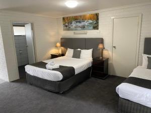 Postel nebo postele na pokoji v ubytování Frankston Motel