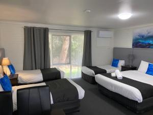 Postel nebo postele na pokoji v ubytování Frankston Motel