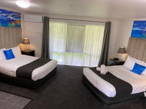 Postel nebo postele na pokoji v ubytování Frankston Motel