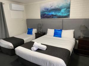 Postel nebo postele na pokoji v ubytování Frankston Motel