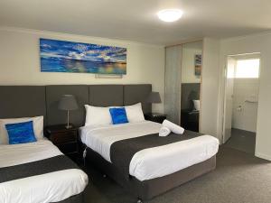 Postel nebo postele na pokoji v ubytování Frankston Motel
