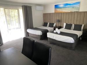 Postel nebo postele na pokoji v ubytování Frankston Motel