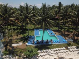 an aerial view of a resort with palm trees at Sumatra Surf Resort in Biha