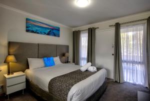 Postel nebo postele na pokoji v ubytování Frankston Motel