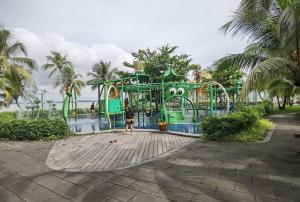 a playground in a park with a water slide at Carnelian Tower - Sea View FC4219 in Gelang Patah
