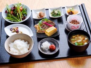 a tray of food with rice and bowls of food at remm Shin-Osaka in Osaka