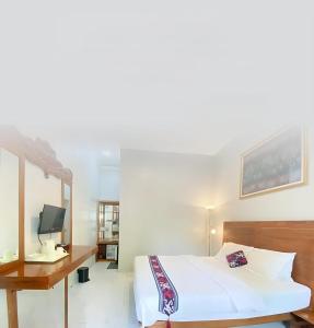 Voodi või voodid majutusasutuse Nusantara Hotel Syariah toas