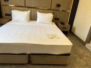 Postel nebo postele na pokoji v ubytování Istanblu Hotel Ataşehir