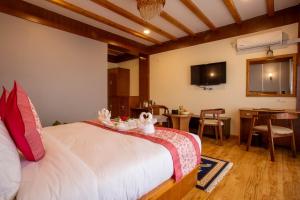 a bedroom with a bed and a dining room at Hotel Ghyampe Dada in Bhaktapur