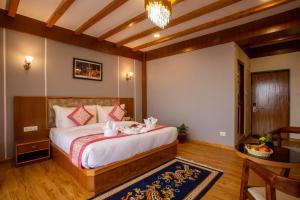 Letto o letti in una camera di Hotel Ghyampe Dada