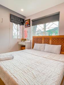מיטה או מיטות בחדר ב-Love Hotel & Apartments