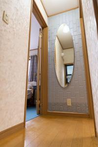a hallway with a mirror on a wall at Morden stylish villa--Max12p--2Bathrooms--Free wifi in Tokyo