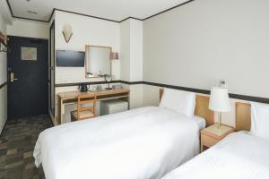东京浅草筑波快速船舶酒店(Vessel Inn Asakusa Tsukuba Express)房間的床