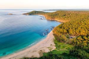 an aerial view of a beach and the ocean at Pebbly Beach Escape in East Lynne