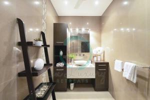 a bathroom with a sink and a mirror at Zen Bayview Bliss: Luxury Marina Mansion in Stuart Park