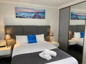 Postel nebo postele na pokoji v ubytování Frankston Motel
