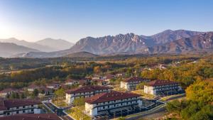 an aerial view of a town with mountains in the background at Kensington Resort Seorak Valley in Sokcho