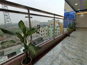 a balcony with a view of a city at Hotel D-Palace in Dhaka