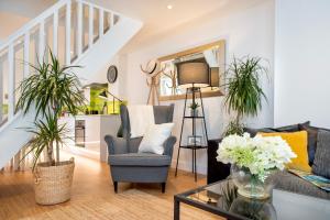 a living room with a couch and a chair at Luxury Town House, Tavistock (sleeps 4) in Tavistock