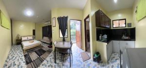 a room with a kitchen and a living room at Building 37 in Bacolod +5 photos
