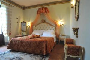 Postel nebo postele na pokoji v ubytování Relais Castelluccio Palusse