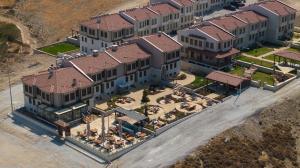 an overhead view of a large building with a courtyard at La Luz Hotel & Spa Bozcaada in Bozcaada