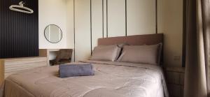 a bedroom with a bed with a mirror on the wall at Mykey Bali A-36-10 Melaka City in Melaka +48 photos