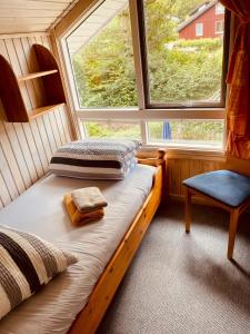 a bedroom with two beds and a window at Komfort-Ferienhaus Sonnental in Extertal