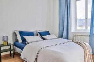 Ένα ή περισσότερα κρεβάτια σε δωμάτιο στο Appartement beau confort