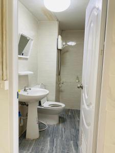 a bathroom with a toilet and a sink at Condo popular T8 fl.6 in Thung Si Kan