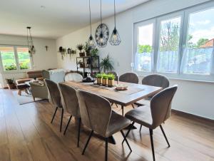 a dining room with a table and chairs at Holiday Home Lino in Brod Moravice +17 photos