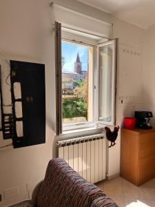 a living room with a window with a view of a city at Centralissimo - Nuovo - Parcheggio Privato in Perugia