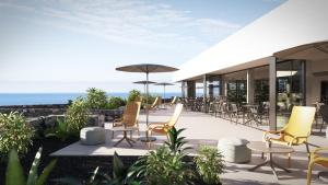 a rendering of a patio with chairs and tables at BANCAL HOTEL and SPA in San Sebastián de la Gomera