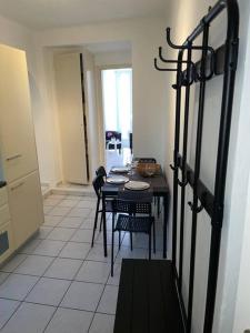 a dining room with a table and chairs in a room at Gemütliche Wohnung im Borgo Ascona in Ascona +7 photos