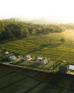 an aerial view of a house in a field at Northland Pai in Pai
