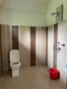 a bathroom with a toilet and a sink at Tara guesthouse - Sauraha,Chitwan in Sauraha