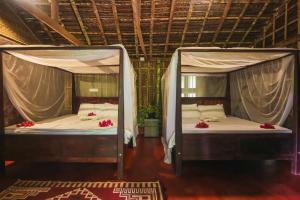 Palm Trees Ayurvedic Heritage客房内的一张或多张床位