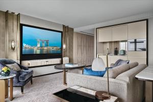 a living room with a couch and a large window at Marina Bay Sands in Singapore